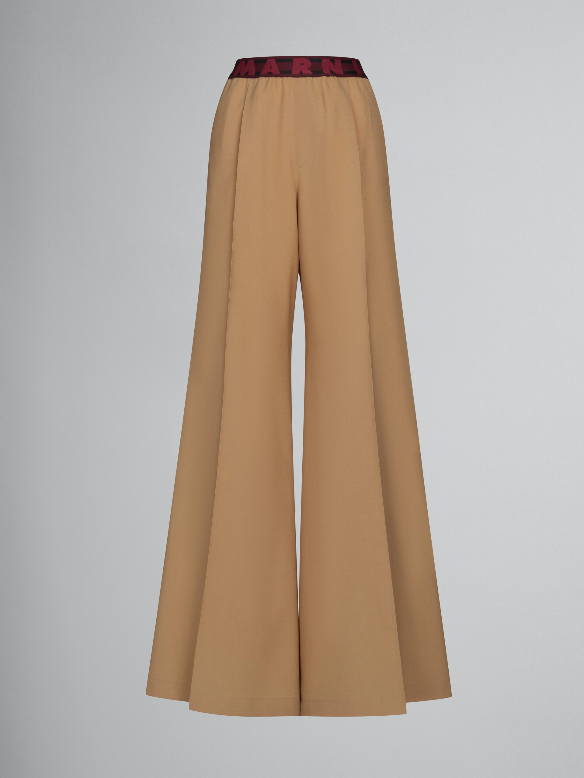 Pantaloni svasati in lana beige con logo in vita - Pantaloni - Image 1