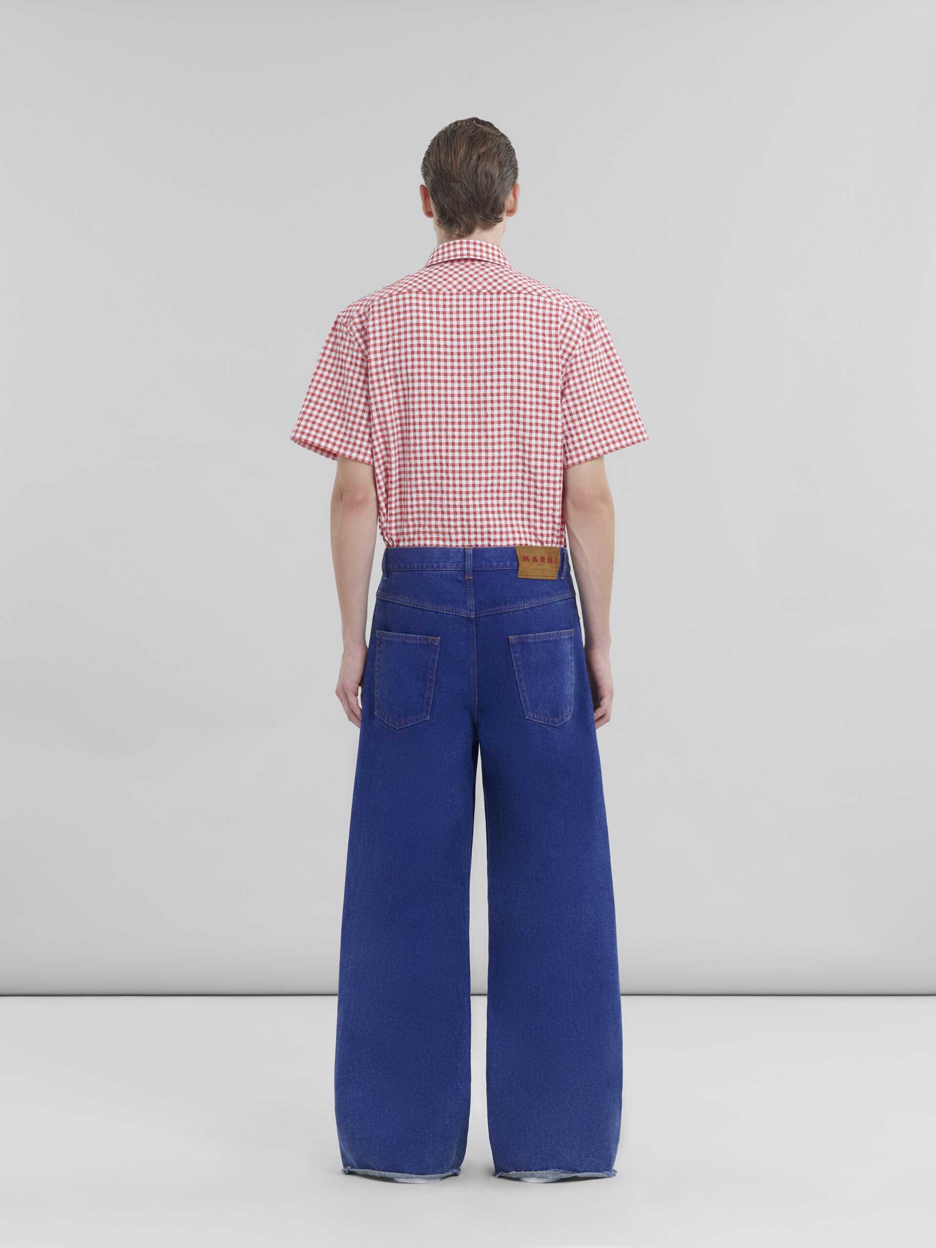 Low rise blue jeans with red belt - Pants - Image 3